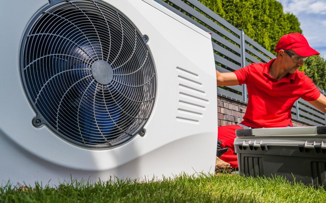 Professional HVAC Worker Installing Swimming Pool Heat Pump